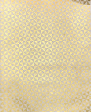 gold triangles on cream sheet